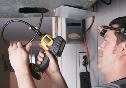 Certified Industrial Hygienist conducting air quality assessment at an industrial facility in Qatar.