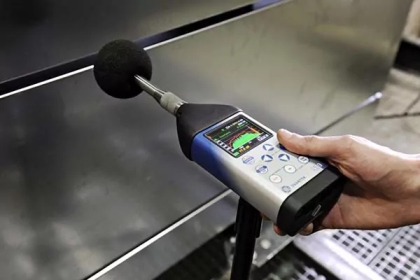 Occupational hygienist using a sound level meter during OHTA W503 noise measurements training.