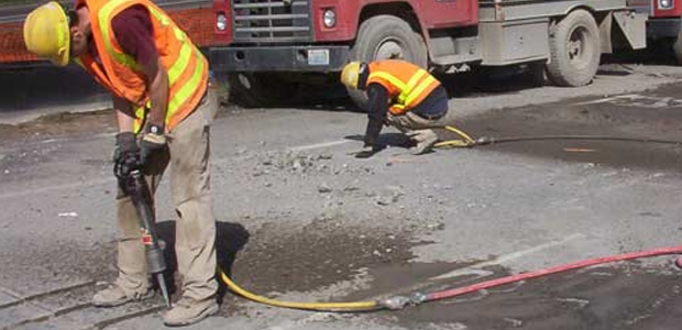 Worker operating heavy machinery during Whole Body Vibration Assessment in Qatar.