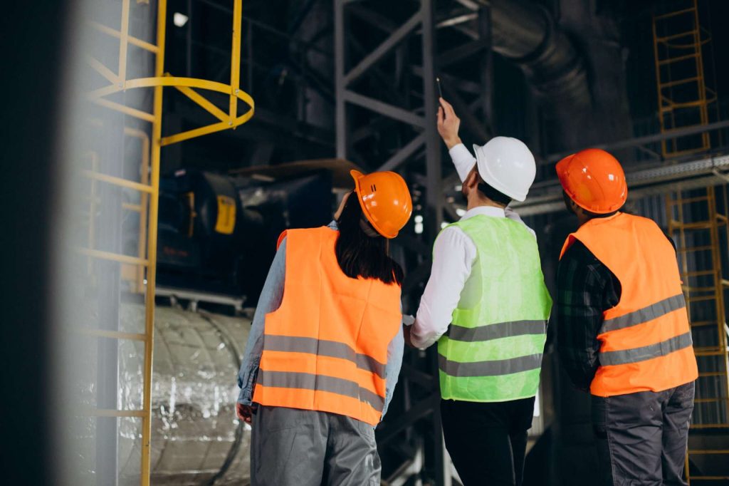 Safety consultant conducting HSE audit at workplace in Qatar.