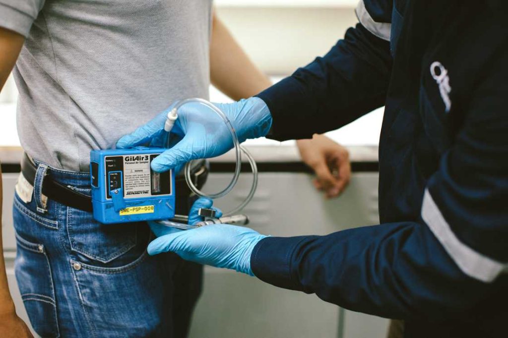 Industrial hygienist performing workplace exposure monitoring in Qatar