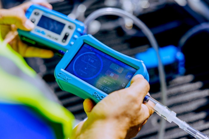 Industrial hygienist performing dust and fume sampling at a Qatar workplace