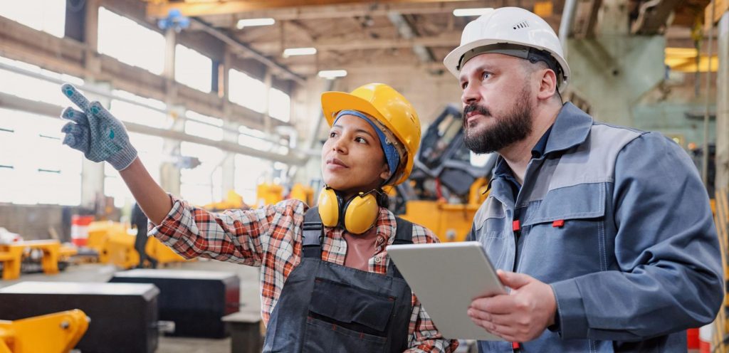 Consultant reviewing worker welfare requirements at a workplace in Qatar