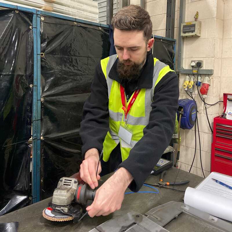 Safety professional conducting vibration safety assessment on industrial equipment in Qatar