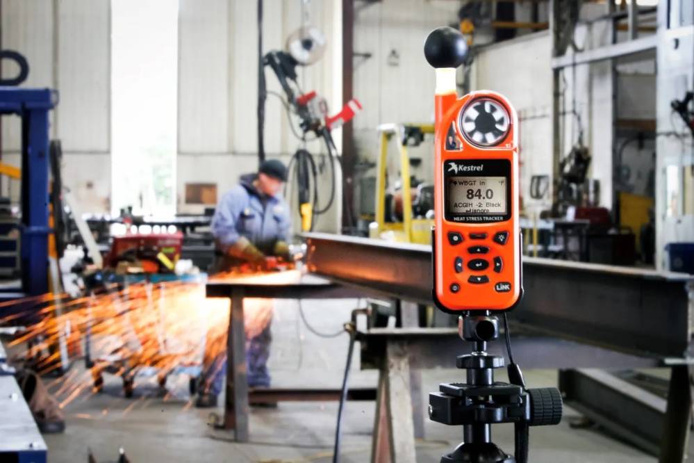 Heat stress specialist conducting WBGT monitoring in Qatar workplace