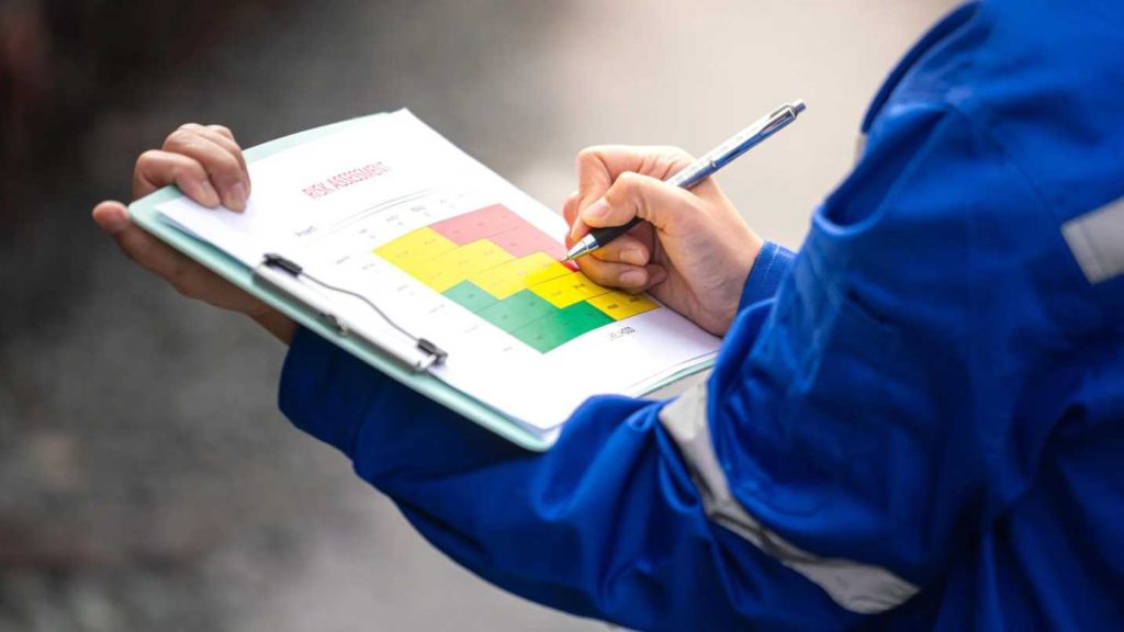 Occupational hygienist conducting vibration risk assessment on construction equipment in Qatar