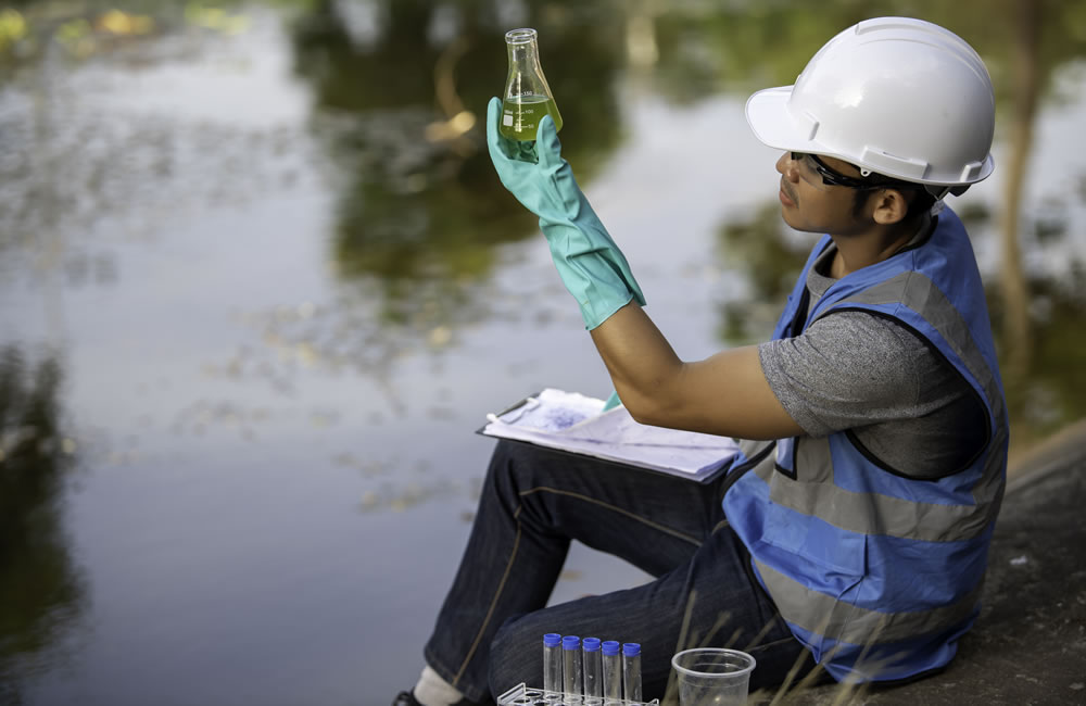 Environmental consultant conducting air and water quality assessment in Qatar