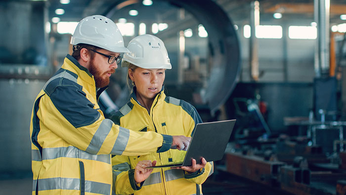 Occupational hygienist conducting workplace exposure monitoring at an industrial site in Qatar