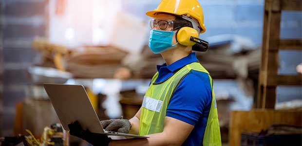 Industrial hygienist conducting workplace exposure monitoring at an industrial site in Qatar