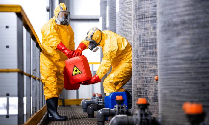 Industrial workplace managing chemical risks with proper storage, labeling, and safety controls